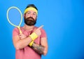 Athlete hold tennis racket in hand on blue background. Tennis sport advertisement. Tennis club concept. Man bearded