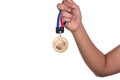 Athlete holding gold medal with ribbon with his hand Royalty Free Stock Photo