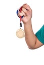 Athlete holding gold medal with ribbon with his hand Royalty Free Stock Photo