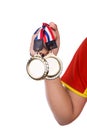 Athlete holding gold medals with ribbon with his hand Royalty Free Stock Photo