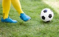 Athlete Kicking a soccer ball on field. Royalty Free Stock Photo