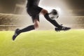 Athlete kicking a soccer ball Royalty Free Stock Photo