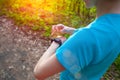 The athlete looks at his watch.