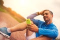 Athlete looks into the smartphone after a workout