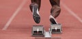 Athlete male feet on starting block Royalty Free Stock Photo