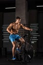 Athlete man biking in the gym. Royalty Free Stock Photo