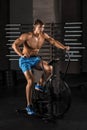 Athlete man biking in the gym. Royalty Free Stock Photo