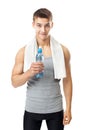 Athlete man offering a water bottle Royalty Free Stock Photo