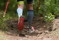 Athlete man running mountain marathon along a forest trail