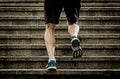 Athlete man with strong leg muscles training and running urban city staircase in sport fitness and healthy lifestyle concept Royalty Free Stock Photo