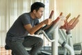 Athlete men, sport exercise concept. handsome man training on bicycle machine at gym in morning. People workout on machine Royalty Free Stock Photo