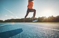 Athlete in mid air while sprinting down a running track Royalty Free Stock Photo