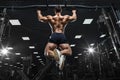 Athlete muscular fitness male model pulling up on horizontal bar Royalty Free Stock Photo