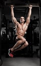 Athlete muscular fitness male model pulling up on horizontal bar Royalty Free Stock Photo