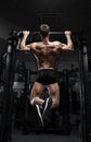 Athlete muscular fitness male model pulling up on horizontal bar Royalty Free Stock Photo