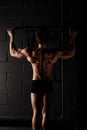 Athlete muscular fitness male model pulling up on horizontal bar Royalty Free Stock Photo