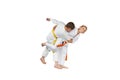 An athlete with an orange belt is doing judo throw