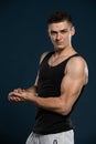 An athlete outside the bodybuilding waters shows off his muscles by flexing his arm muscles. Royalty Free Stock Photo