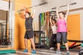 Athlete people doing press exercise with bar without weights in the gym Royalty Free Stock Photo