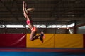 Athlete Performing a Long Jump In Gym Royalty Free Stock Photo