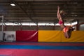 Athlete Performing a Long Jump In Gym Royalty Free Stock Photo