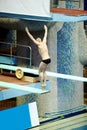 Athlete performs jump from springboard