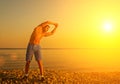 Athlete , playing sports and yoga on beach Royalty Free Stock Photo