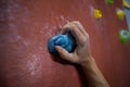 Athlete practicing rock climbing in fitness studio Royalty Free Stock Photo