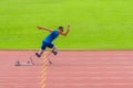 Athlete with prosthetics sprints instantly from start, displaying exceptional speed on stadium track