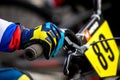 An athlete in a protective glove holds the handlebars Royalty Free Stock Photo