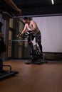 Athlete on pumped bicycle up a bike trainer legs training gym fit, for feet people in body for shape bodybuilder, ay man Royalty Free Stock Photo