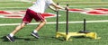 Athlete pushing weighted sled on turf field Royalty Free Stock Photo