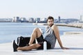 Athlete resting by sea Royalty Free Stock Photo