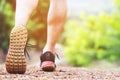 Close up shoe fitness people runner athlete running at on road in public park. Fitness and exercise workout wellness concept. Royalty Free Stock Photo
