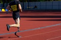 Athlete running with a prosthetic leg at a stadium Royalty Free Stock Photo