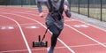 Athlete running while pulling a sled with weight on top Royalty Free Stock Photo
