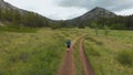 Athlete runs a cross-country marathon in the mountains. Trail running active lifestyle