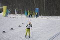 Athlete runs skiing cross-country at the finish line