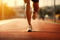 An athlete sprinting on a race track in the stadium