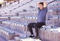 Athlete, stretching and arms in sports stadium with man for race, competition or marathon. Male runner, wellness and Royalty Free Stock Photo