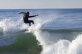 Athlete surfing on Santa Cruz beach in California