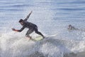 Athlete surfing on Santa Cruz beach in California