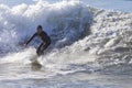 Athlete surfing on Santa Cruz beach in California