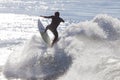 Athlete surfing on Santa Cruz beach in California