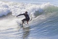 Athlete surfing on Santa Cruz beach in California