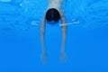 Athlete swimmer swims underwater, top view. Healthy lifestyle and sport concept.