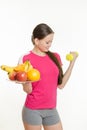 Athlete swings his left hand holding a plate of fruit in his right hand Royalty Free Stock Photo