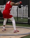 Athlete throwing the weight at a track and field competition Royalty Free Stock Photo