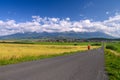 Athlete train under mountains, Beautiful mountains landscape in background Royalty Free Stock Photo