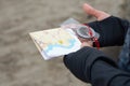 Athlete uses navigation equipment for orienteering,compass and topographic map